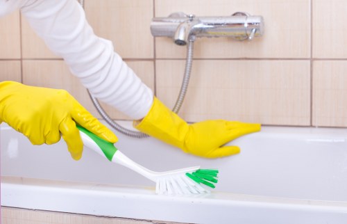 Detailed kitchen and bathroom cleaning during a move out clean in E2